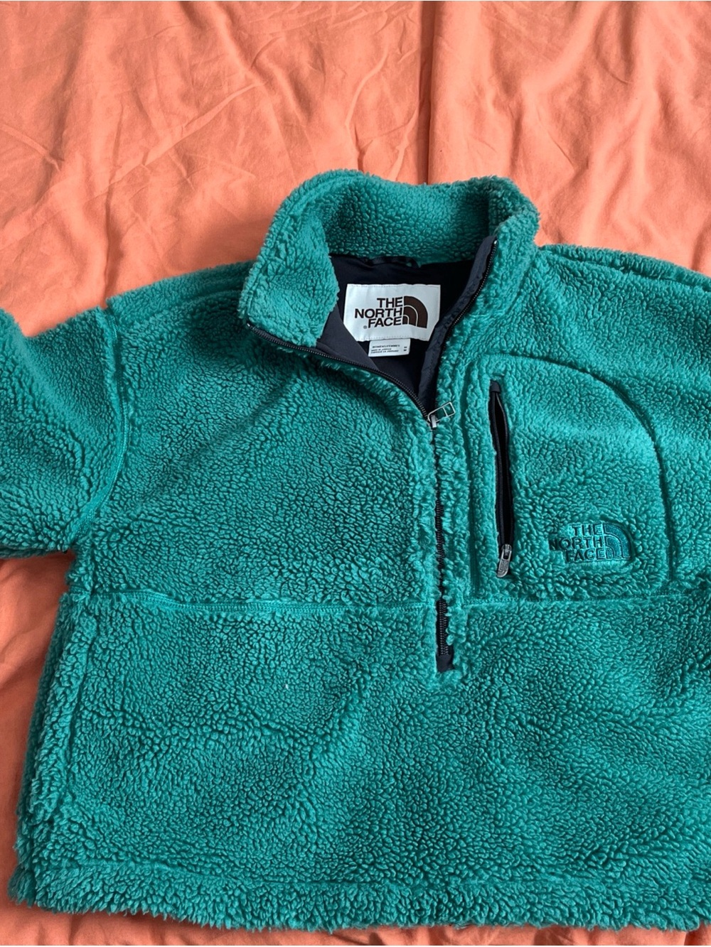 The North Face women’s green
Fleece Pullover Jacket